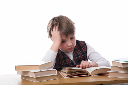 young studiing boy isolated on white backgroung